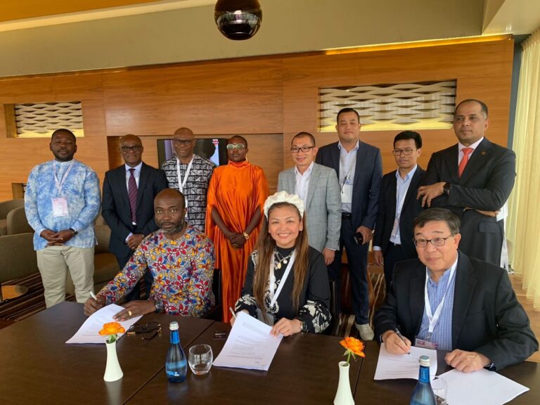 Amor Maclang of Digital Pilipinas while signing the partnership agreement with Professor David Lee of GFI and Dr. Patrick Saidu Conteh of AFN