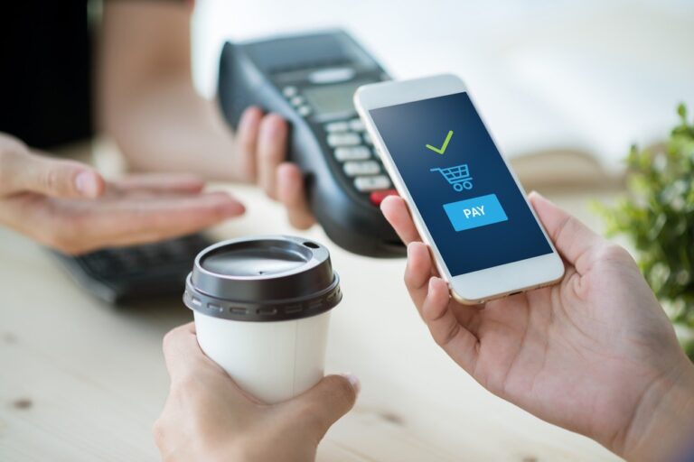 A mobile phone used to digitally pay for coffee
