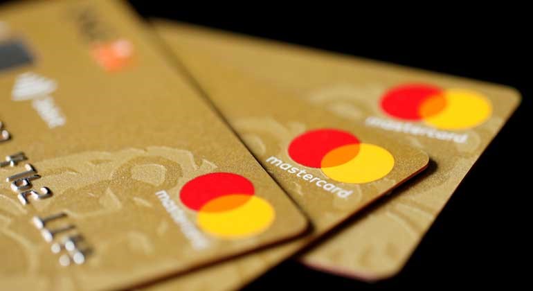 Three credit cards with the Mastercard logo