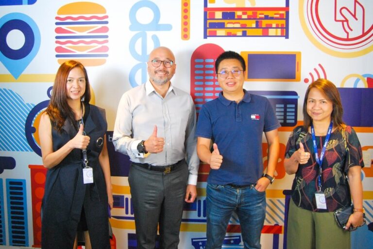 Mocasa's Robin Wong does the thumbs up sign together with AFPI executives after a MOA-signing ceremony