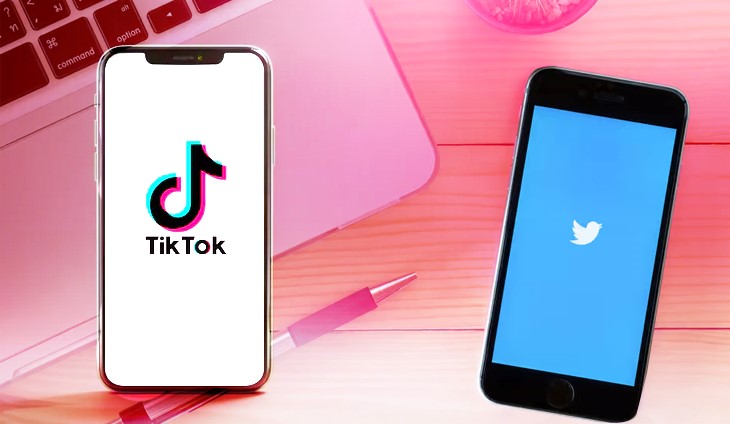Two mobile phones, one showing the TikTok logo and the other, Twitter