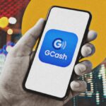 A mobile phone with the GCash app and logo