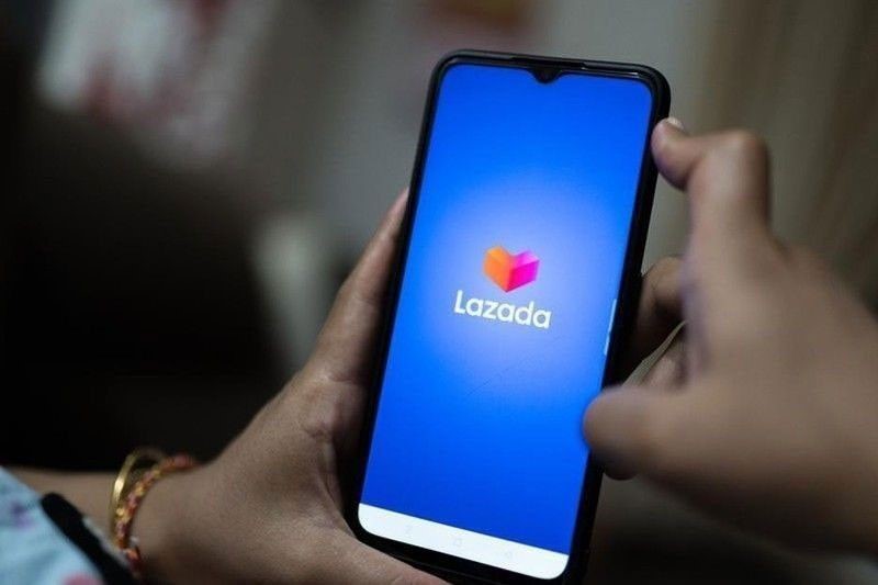 A mobile phone with logo of Lazada