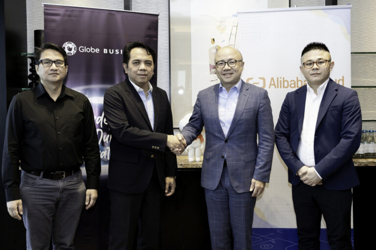 Jay Abada, Globe Business’ Cloud Portfolio Director, together with top executives of Alibaba Cloud after sealing the deal with a handshake