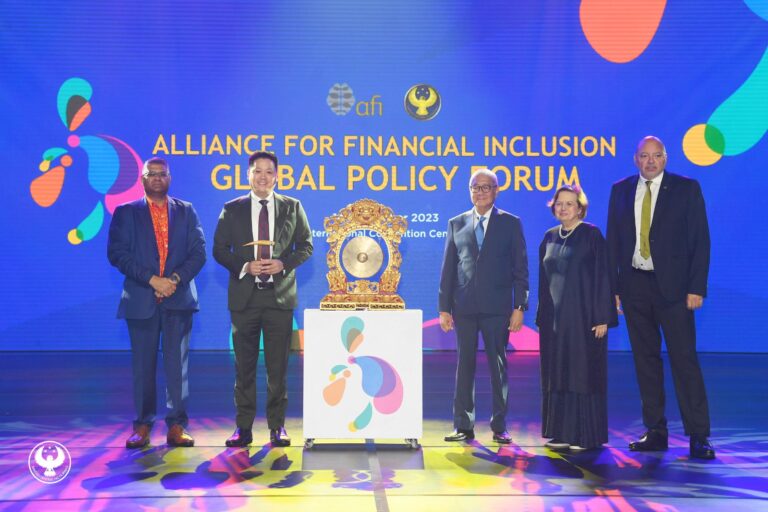 The country's economic managers led by BSP Governor Eli Romolona Jr. and members of the Alliance for Financial Inclusion pose for a souvenir photo