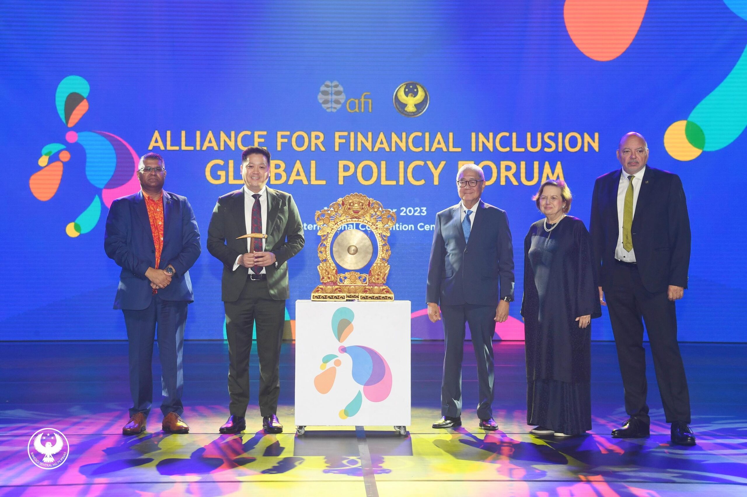 The country's economic managers led by BSP Governor Eli Romolona Jr. and members of the Alliance for Financial Inclusion pose for a souvenir photo