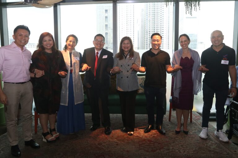 Amor Maclang, convenor of Digital Pilipinas, together with other representatives from the SEC, Radical Fund, and BPI at a climate tech event