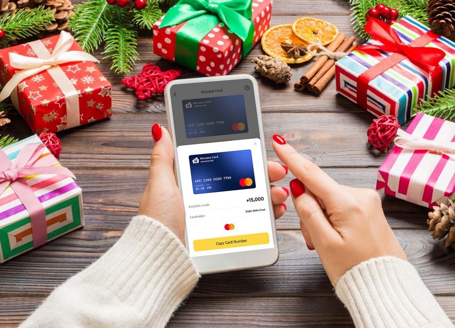 A girl holding a mobile phone, ready to buy online holiday presents through the Mocasa app