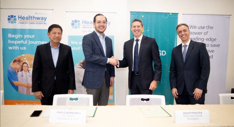 AC Health President and CEO Paolo Borromeo (2nd from left) shakes the hand of MSD Asia Pacific President David Peacock to seal their strategic collaboration to offer high-quality but affordable cancer care in the Philippines. Witnessing the congratulatory handshake are Healthway Philippines, Inc. President and CEO Jaime Ysmael (leftmost) and MSD Philippines President and Managing Director Andreas Riedel