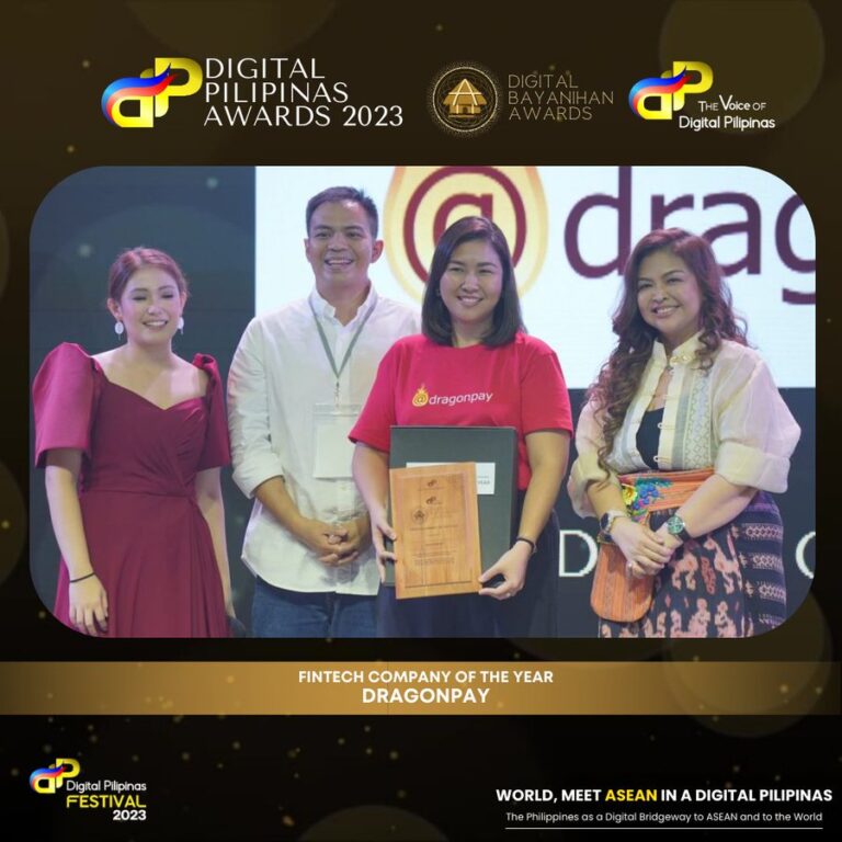 A Dragonpay executive while receiving the award from Amor Maclang after being named "Fintech Company of the Year"