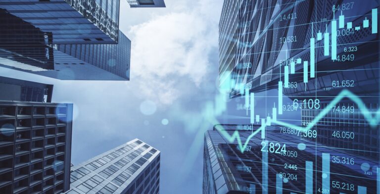 Photo showing real estate, development and investing concepts with financial chart indicators and stock market graphs on city skyscrapers