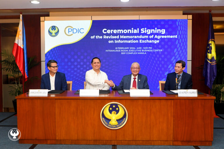 BSP Governor Eli M. Remolona, Jr. and PDIC President and Chief Executive Officer Roberto B. Tan shake hands after signing the BSP-PDIC Revised Memorandum of Agreement on Information Exchange