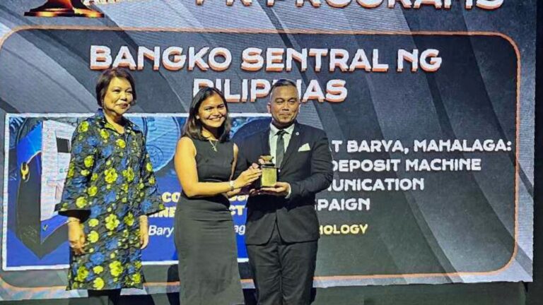 BSP Deputy Director Jann Ryan D. Jose and bank officer Samantha Franchezka S. Ching after receiving the Anvil Silver Award from the PRSP