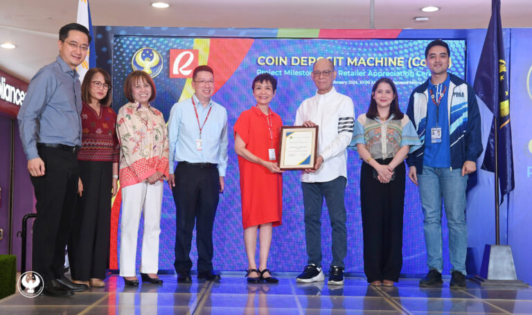 Monetary Board (MB) Member Benjamin E. Diokno (third from right) hands over the certificate of appreciation as a Coin Deposit Machine Project partner retailer to top executives of Robinsons Retail Holdings, Inc. (RRHI)