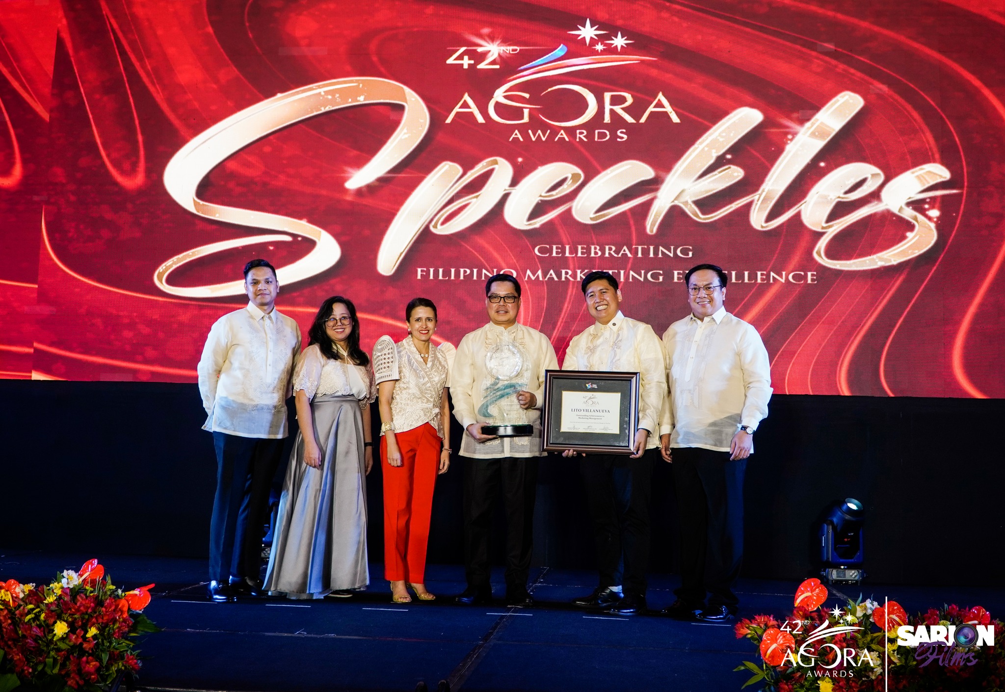 Executives of UnionBank executives while accepting the plaque from Agora Awards