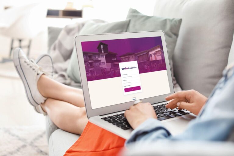 A person typing on a laptop with an app that says how one can secure real estate investments with Aboitiz Land