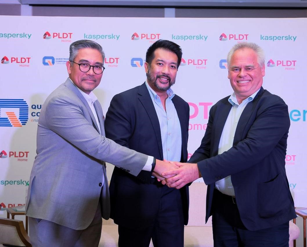 Mike Dionisio, President of Questronix; Jeremiah de la Cruz, SVP and Head of Consumer Business at PLDT Home; and Eugene Kaspersky, CEO of Kaspersky, while shaking hands during the event