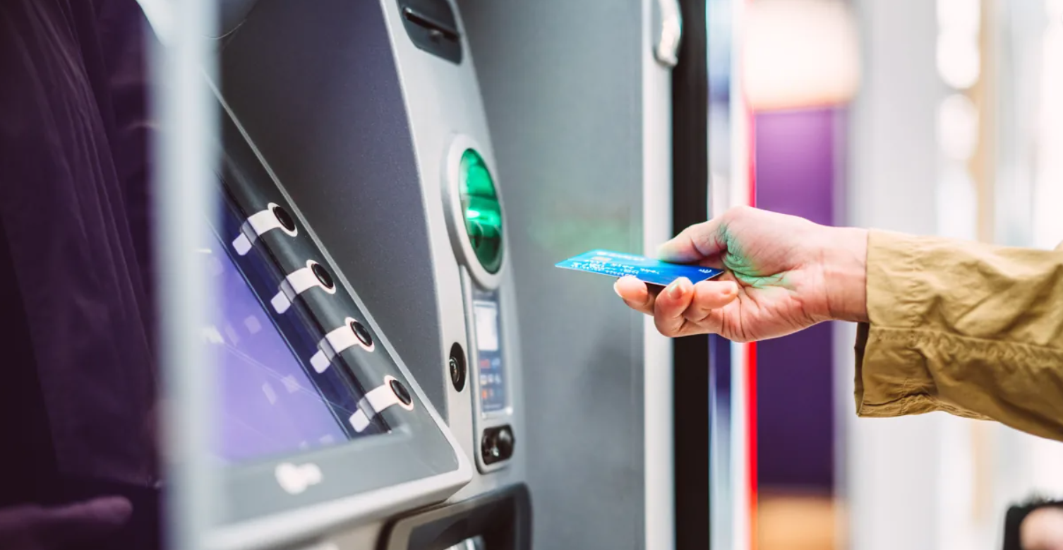 A card about to be inserted in an ATM machine shows how the global IT meltdown caused by 'Falcon Sensor' exposed vulnerability in banks' digital systems