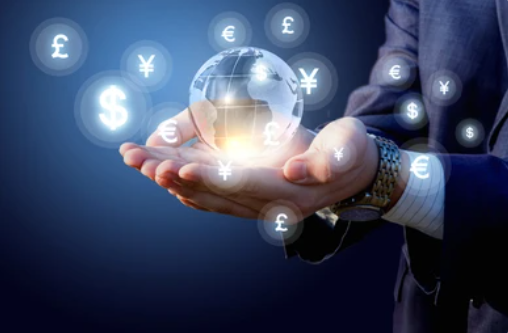 A hand holding a miniature globe to illustrate how BSP enhancing Forex regulations can ensure financial stability