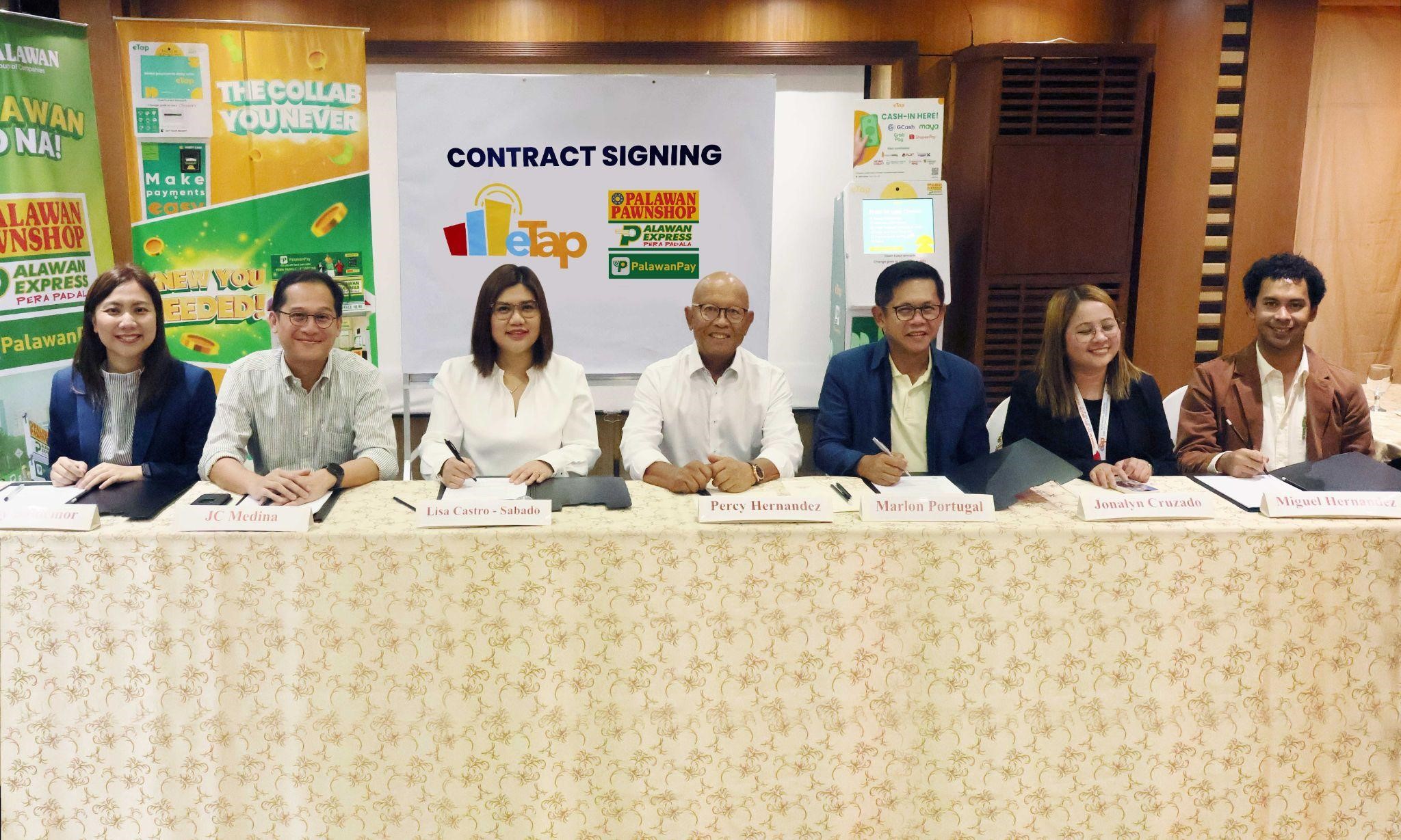 Palawan’s Head of B2B Group, Miss Baldemor; Head of Innovation, JC Medina; Chief Business Development Officer, Lisa Lou Castro-Sabado; eTap’s CEO, Percy Hernandez; President, Marlon Portugal; COO, Jana Cruzado; and Chief Strategy Officer, Juan Miguel Hernandez during the agreement-signing
