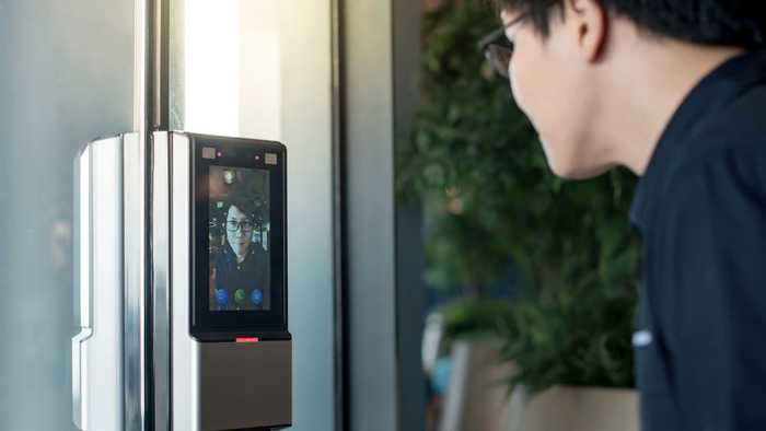 A man takes advantage of the benefits of digital face recognition using UNAWA's SignSecure app