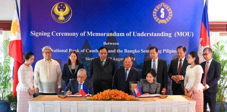 BSP Governor Eli M. Remolona, Jr. (left, seated), and H.E. Dr. Chea Serey (right, seated), Governor of the National Bank of Cambodia, during the signing of a Memorandum of Understanding between the two central banks
