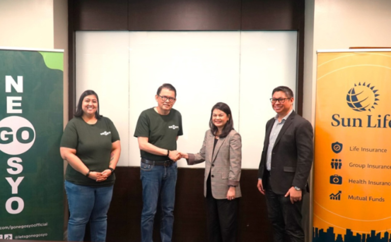 Photo shows Carla Gonzalez-Chong, Chief Client Experience while shaking hand with Joey Concepcion, Founder of Go Negosyo, during the MOA-signing.