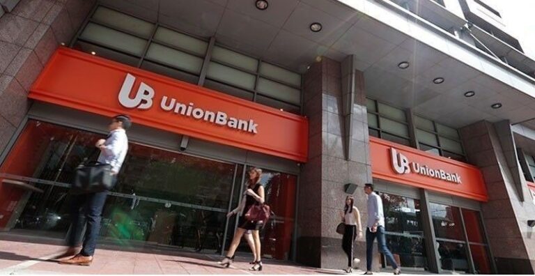 People walking outside UnionBank's office in Manila