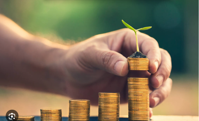 Photo showing a stack of coins to emphasize why it's important to invest