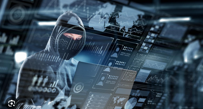 A man in hood with laptop is used here to depict how cybercrime collaboration among Asian nations has been tackled at historic Manila event