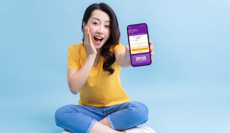 A woman holding out a mobile phone with the Digido app