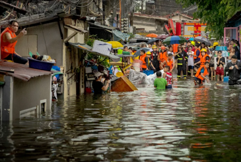MSMEs and ordinary folks alike grapple with the devastation brought about by TY Carina; here, we see a man trying to get a phone signal on a roof top