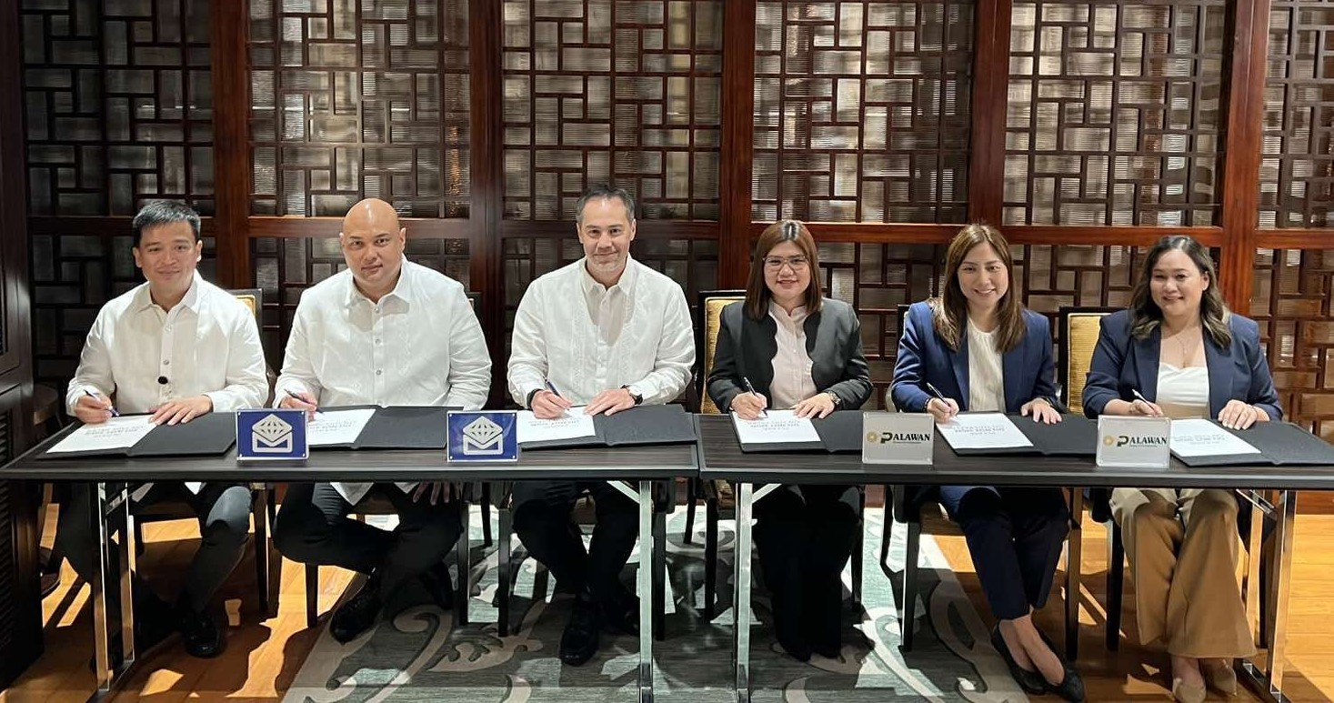 Executives of Palawan Group of Companies led by Lisa Lou Castro-Sabado are shown here during the signing of their partnership agreement with Metrobank