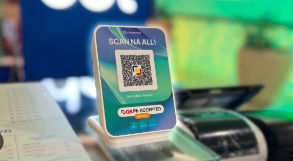 PayMongo, as shown in this photo of a scanner with the app, is strengthening its vision with an SOC 2 Type 2 certification and innovative soundbox launch