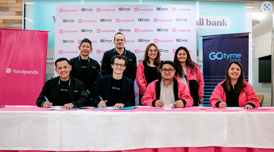 GoTyme and foodpanda executives signing an agreement that gives flexible loan program for MSMEs in PH