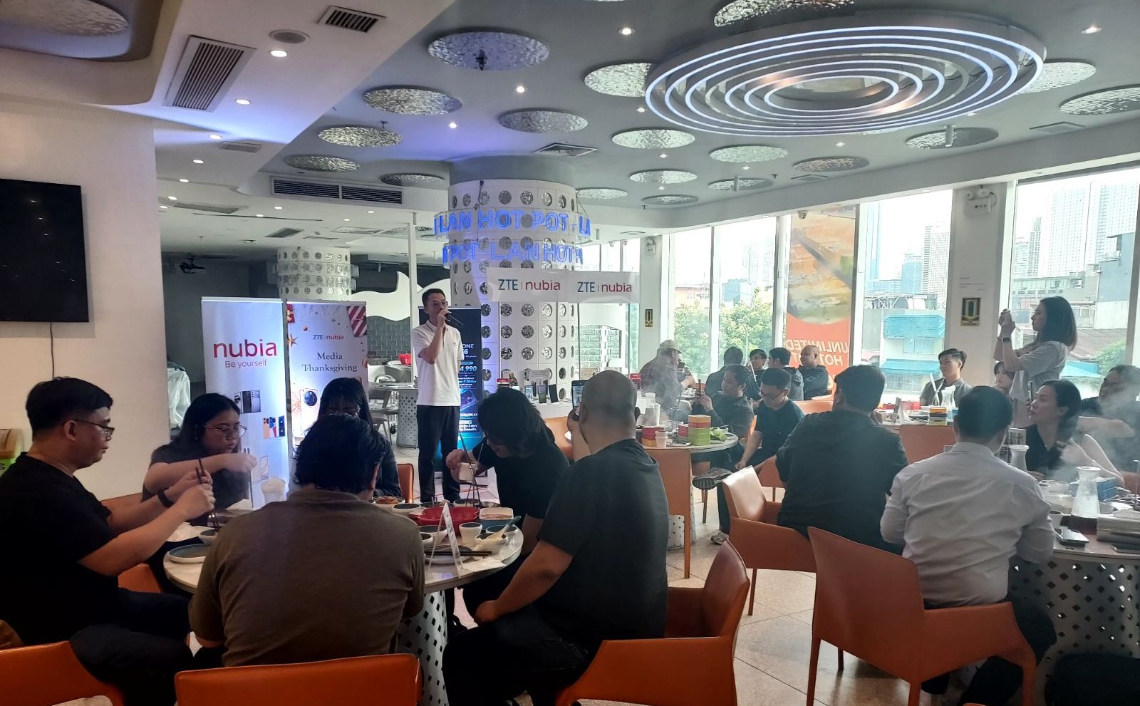 ZTE's Gavin Lian (in photo, with mic), speaks to the media as he shares that ZTE's mobile brand nubia has achieved 300% growth in 2024, and is targeting the gaming community for 2025