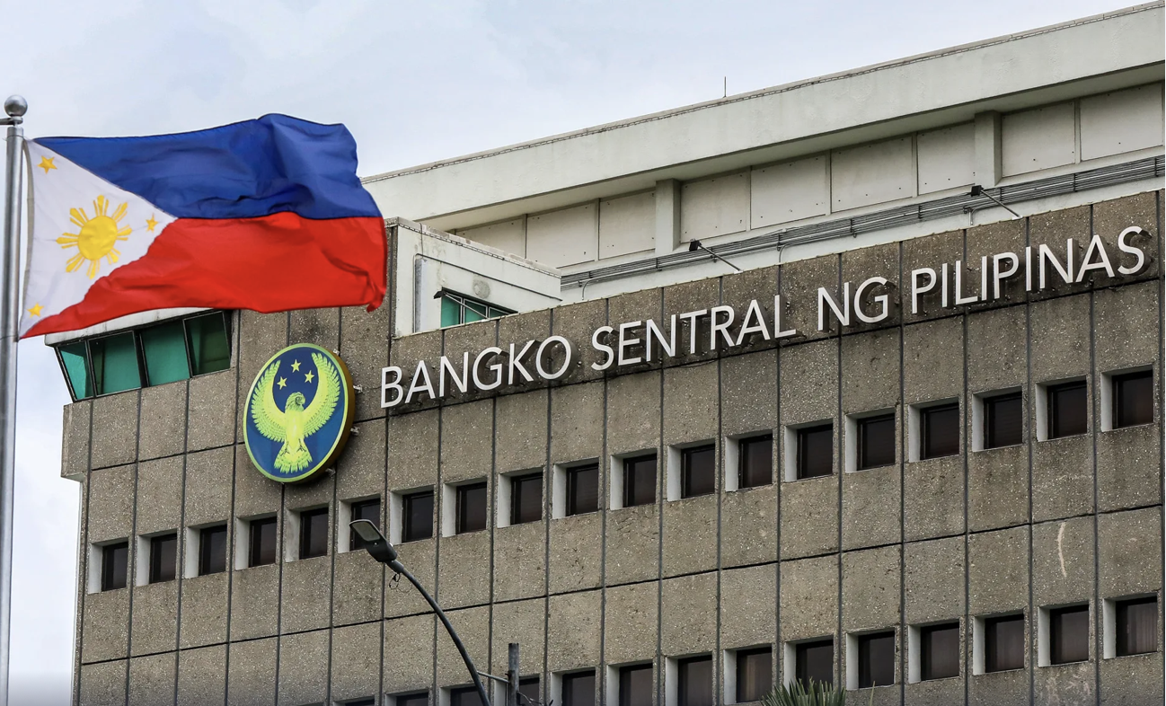 Facade shot of BSP office in Manila with the PH flag as gov't approves US$3.21 billion public sector foreign borrowings in Q4 2024