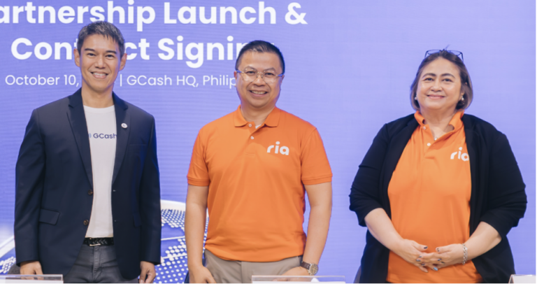 Paul Albano of GCash together with Steve Peregrino and Eileen Roque, both of Ria Money Transfer, during the signing