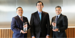 Reginaldo Cariaso (rightmost), newly appointed Deputy CEO of RCBC, while receiving an award from AsiaMoney