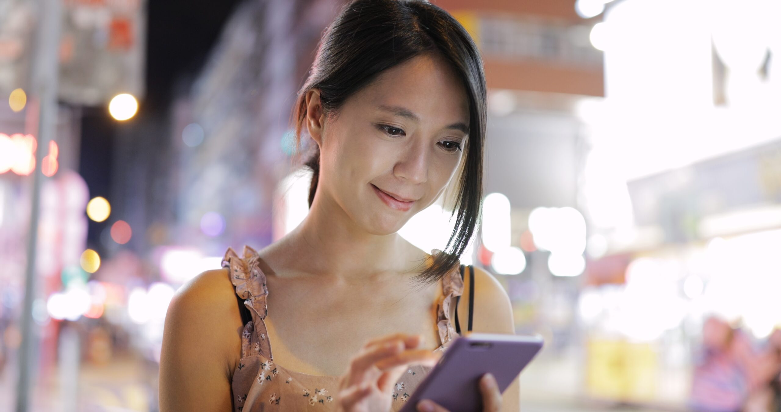 Girl using GCash app on her phone to show how the eC-Savings on GSave allows users to save directly from their e-wallet