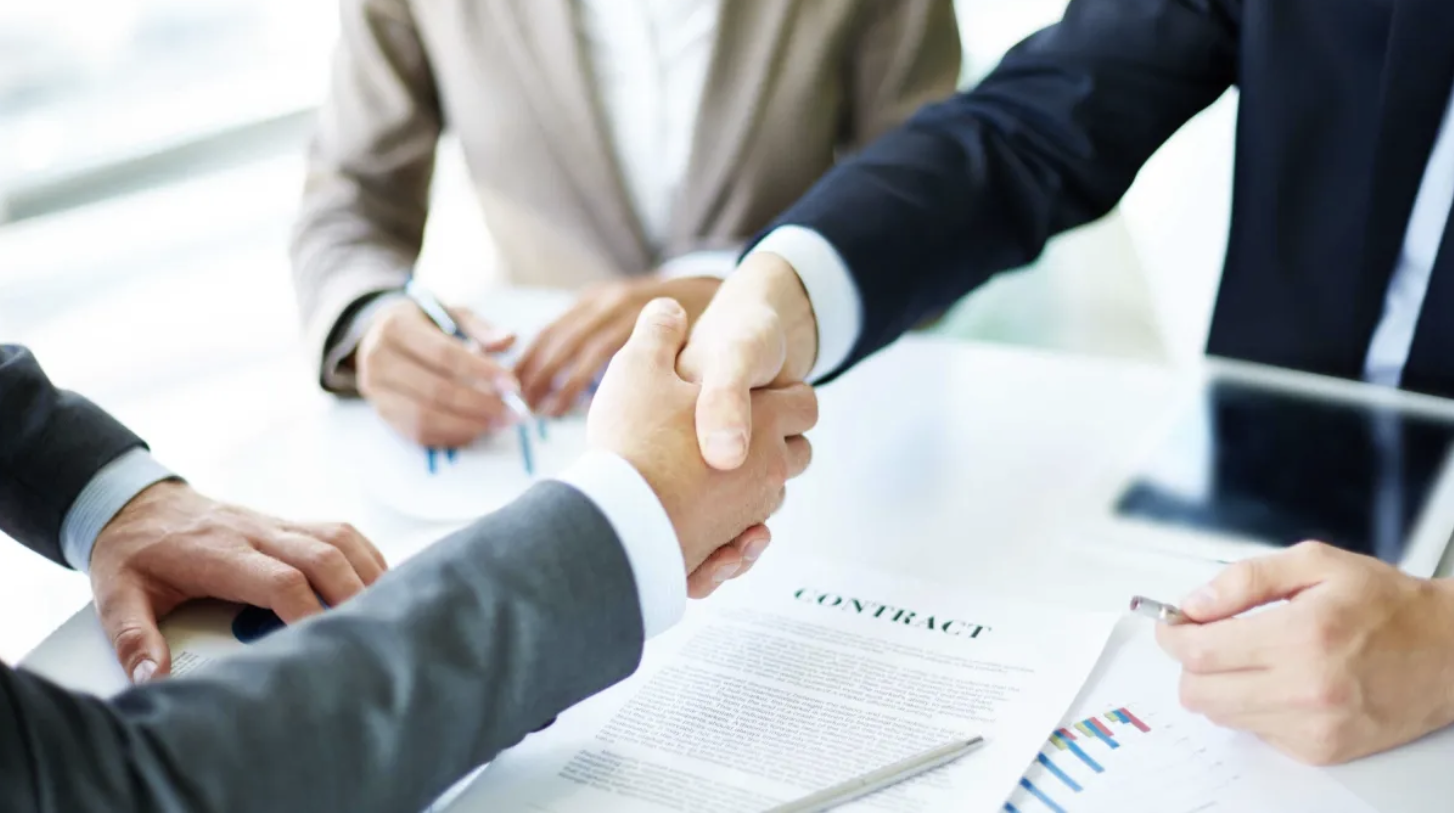 Security Bank, as shown in this handshake, forges strategic alliance with Taxumo to supercharge MSME growth