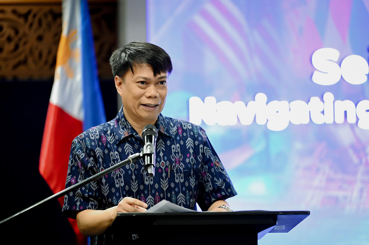 BSP Deputy Governor Abenoja delivering a message of cautious optimism at the forum