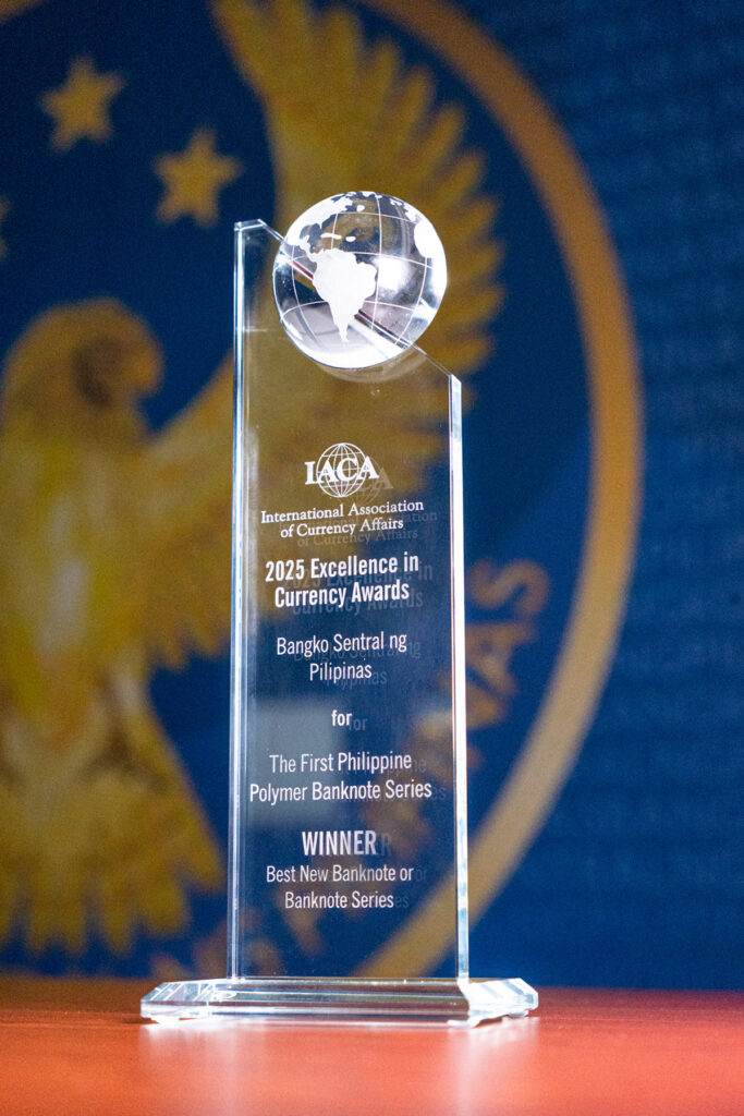 Photo of a plaque from IACA as BSP's polymer banknotes win global acclaim for security and stunning design