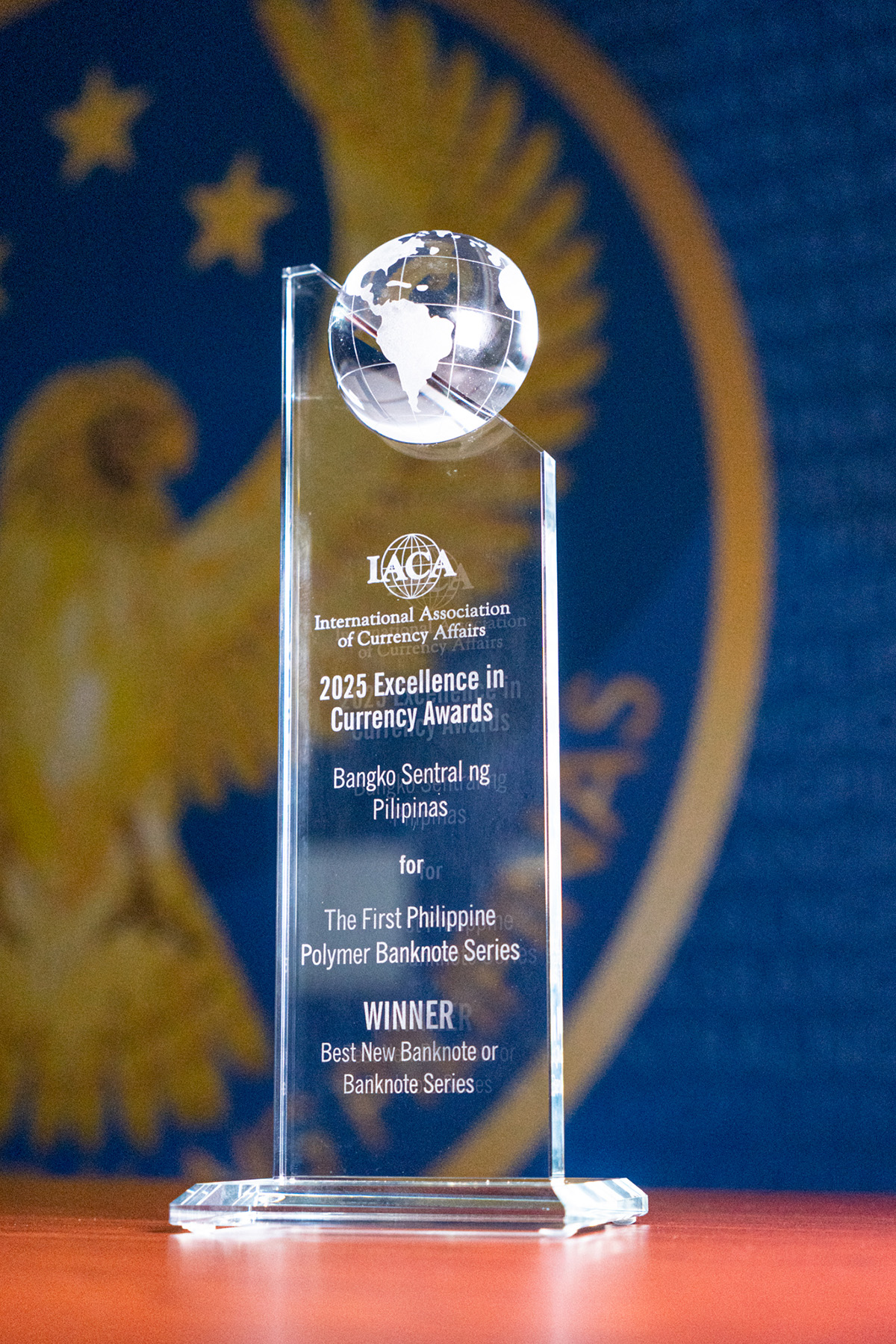 Photo of a plaque from IACA as BSP's polymer banknotes win global acclaim for security and stunning design