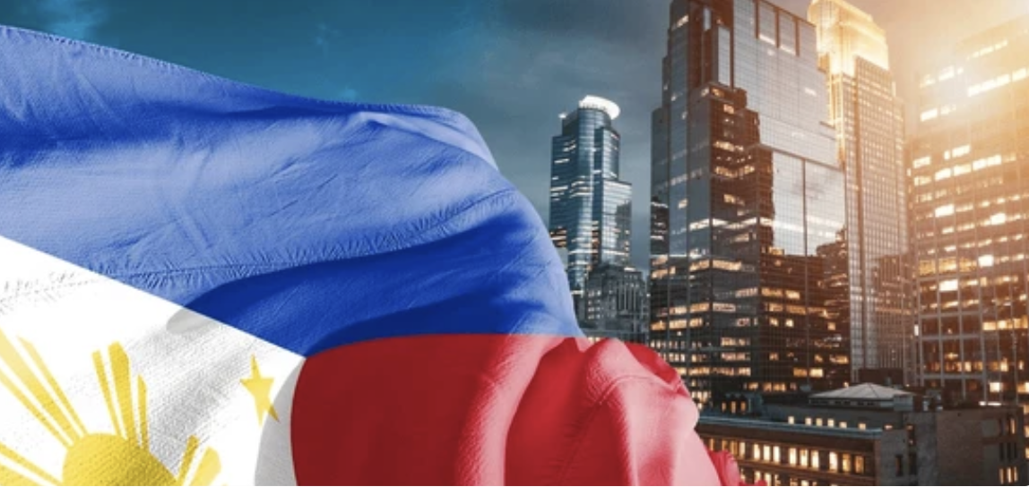 Photo of PH flag and tall buildings to illustrate the BSP's new property price index