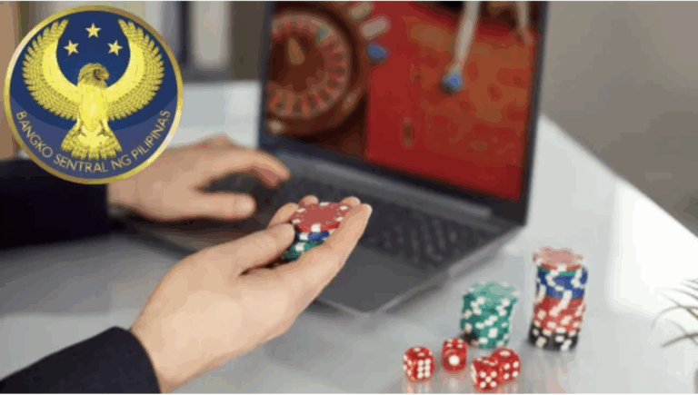 A man holding a pair of dice as the BSP cracks down on online gambling payments to protect Filipinos from financial harm