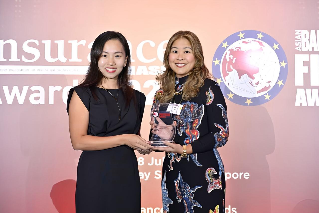 Pia Arellano, president of CIBI, while receiving a plaque during the ABF Fintech Awards 2025 after the company was recognized for advancing financial inclusion