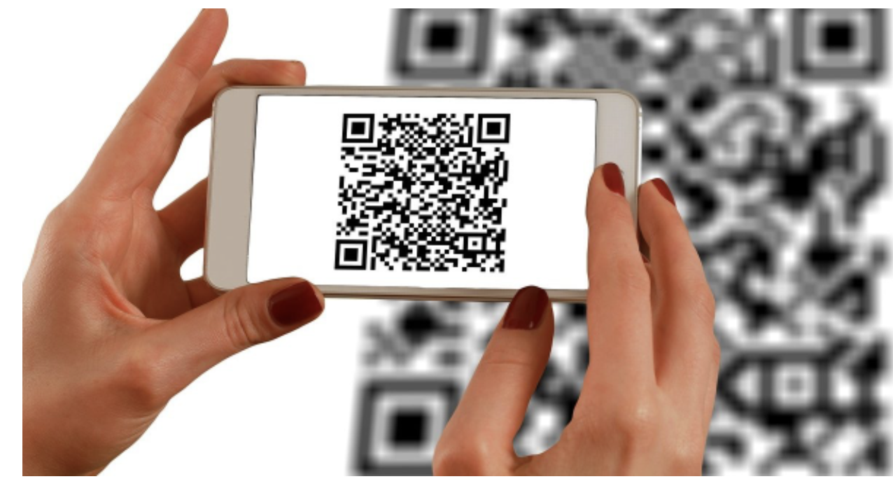 A mobile phone while being used to scan a QR code