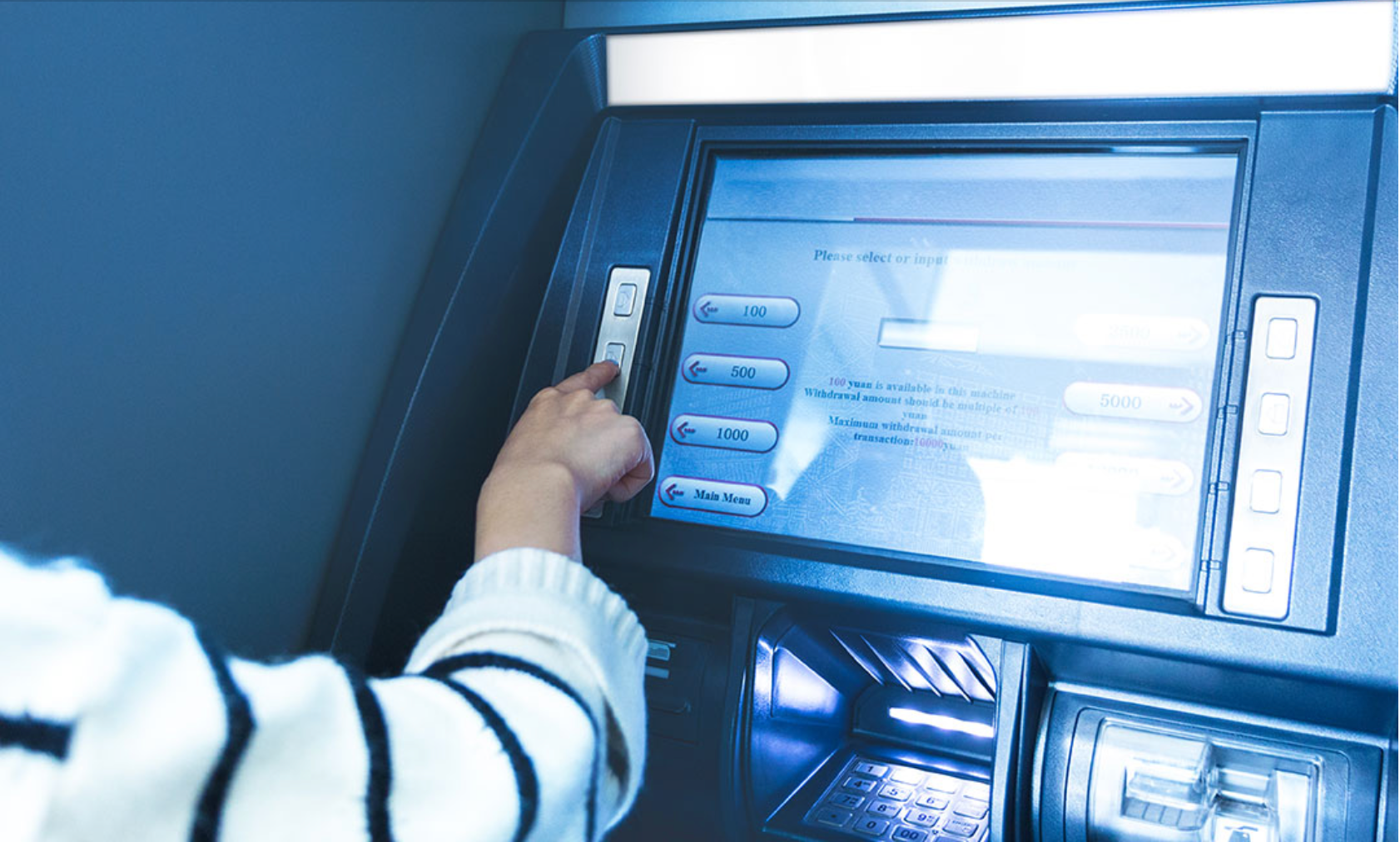 A man inputting personal details on a screen as he conducts fintech transaction