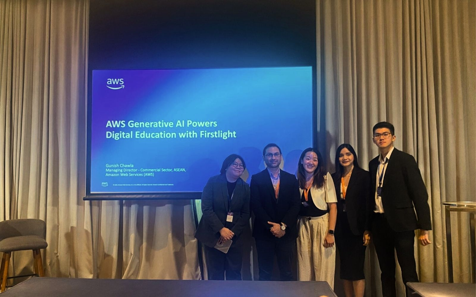 Chrissie Belosillo (left) and her staff at Firstlight join AWS's Gunish Chawla (2nd from left) at AWS Cloud Day Philippines 2025, where they discussed driving innovation in digital education